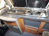 The 1996 Wellhouse Toyota Granvia's kitchen has a stainless-steel Smev twin-ring gas hob and sink