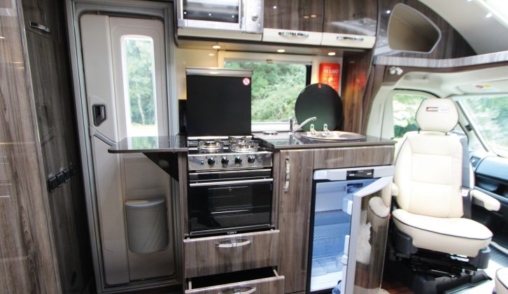 The kitchen is compact but has everything you need, although the microwave is too high