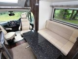 The large and stable freestanding table can be used inside or al fresco – both cab seats swivel and have two armrests