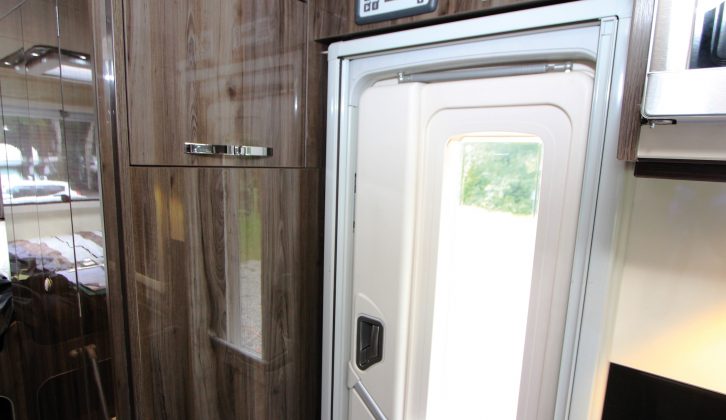 An optional flat-screen TV is in the top locker door adjacent to the door – a multi-jointed, hinged extending arm is included