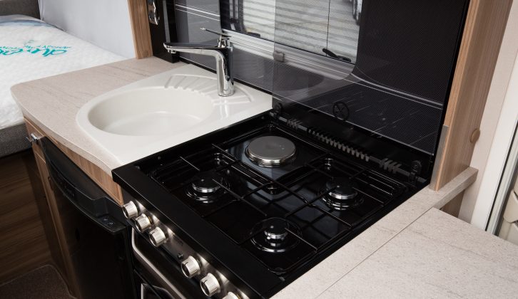 An illuminated splashback and cream locker facings tick the style boxes, while the separate oven and grill, the dual-fuel cooker and the fridge with separate freezer contribute to the super spec