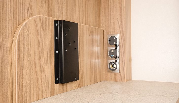 A TV point is located on the washroom bulkhead with power and aerial connections, plus a bracket for attaching a TV stand