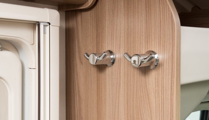 A pair of handy hooks sits next to the habitation door in this Swift Rio 325