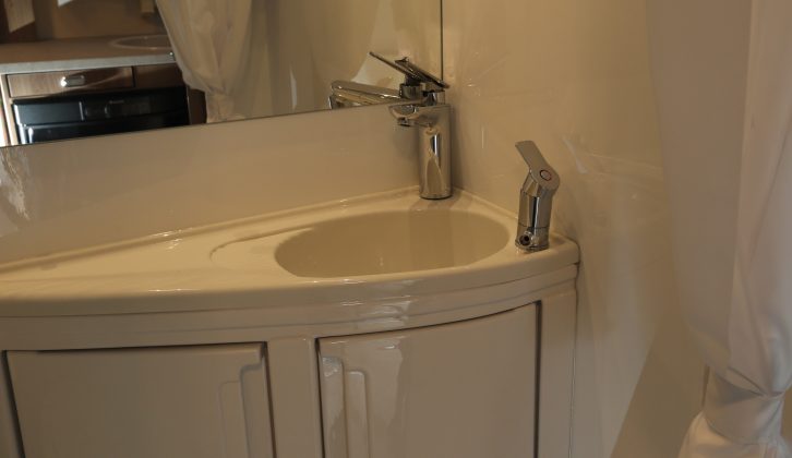 The Swift Escape 622's corner vanity unit has two useful cupboards
