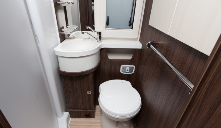 In the washroom is a Thetford C260 loo with plumbed-in electric flush, a smart circular sink, and a decent separate circular shower cubicle