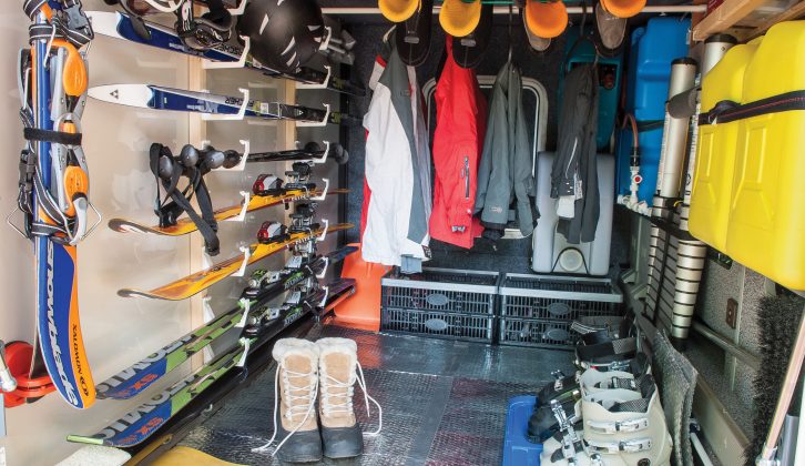 Racks secured non-invasively to the garage’s rear wall easily adapt to storing either summer or winter activity equipment