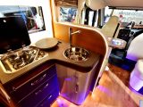 The Pegaso has a well equipped L-shaped kitchen, with an oven and fridge-freezer, and a microwave opposite