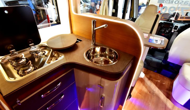 The Pegaso has a well equipped L-shaped kitchen, with an oven and fridge-freezer, and a microwave opposite