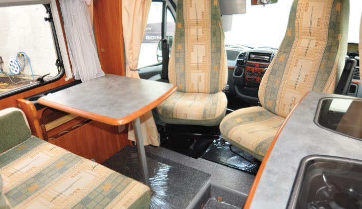 Cab seats swivel in the Dethleffs to create more lounge space, but the table is rather small. The cab can be curtained off for privacy