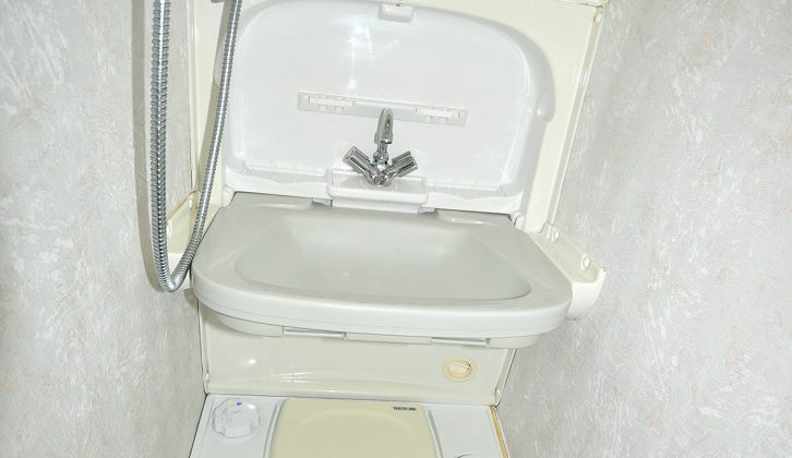 The washroom in the Vista's rear offside is small, but has a toilet, drop-down sink and little shower space