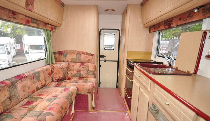 Make the double bed by pulling out the Vista's L-shaped sofa base; note the entrance is at the rear of the 'van