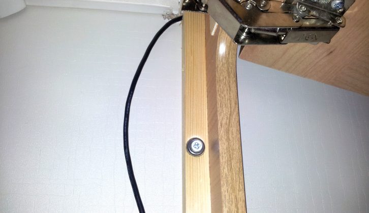 The cable is fed into the right-hand end cupboard and then the left-hand one