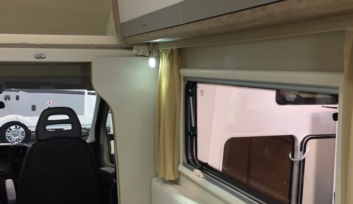 The two-tone lockers in this Venus 590HL also give this motorhome an elegant feel inside