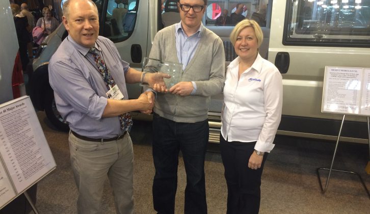 Rex Kneebone, Proprietor of Murvi Motorcaravans, accepts 2016’s Platinum Award trophy to recognise consistent excellence in the Practical Motorhome Owner Satisfaction Awards since its inception in 2004, from Editor Niall Hampton and Sarah Baird, RV Business Development Manager of awards sponsors Whale