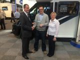 Mark Andrews, Sales Executive at Becks Motorhomes, accepts the trophy for highest-scoring supplying dealer of new motorcaravans in the Practical Motorhome Owner Satisfaction Awards 2016 from Editor Niall Hampton and Sarah Baird, RV Business Development Manager of awards sponsors Whale