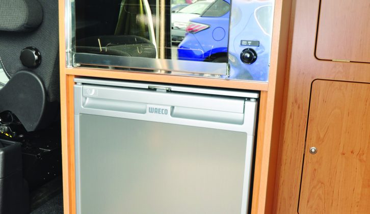The standard-fit SMEV grill and Waeco 􏰕􏰔-litre compressor fridge are in a practical and convenient location in the galley