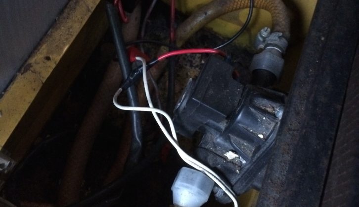 Elderly water pump occupies the space usually reserved for a leisure battery in a T25 camper
