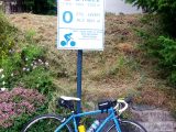 The sportive riders make a welcome food stop at Col du Glandon