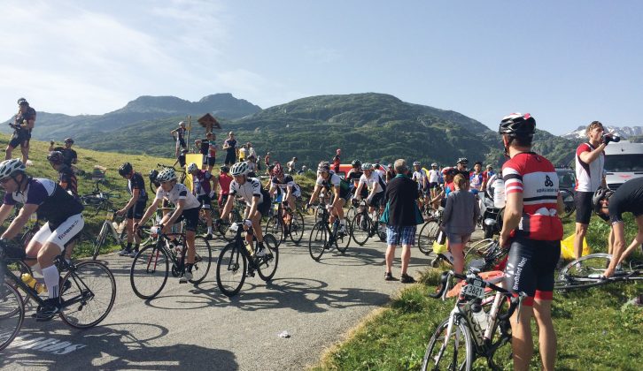 Cyclists take a rest on the long climb to L'Alpe d'Huez
