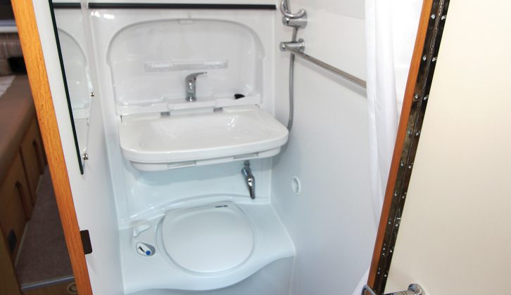 The central washroom has a forward-facing door, wipe-clean walls, and provides room for dressing