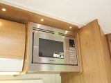 The Imala kitchen specification includes a microwave oven, dual-fuel hobs, separate oven and grill and a dual-fuel fridge