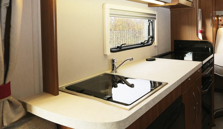 The 7.25m-long Auto-Trail Imala 730's kitchen has a good worktop, boosted by the sink and cooker lids