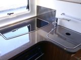 The Adria has a compact L-shaped kitchen, but it's got a decent amount of kit, as you can find out on Practical Motorhome TV