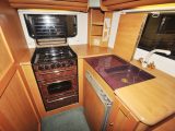 The Auto-Trail Tracker has an amazing kitchen for such a small vehicle, with a cooker, sink, drainer, worktop and more