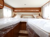 At the rear are two fixed single beds, which are accessed by three steps between them, with padded headboards and Bultex density foam mattresses – each measures 2m x 0.85m