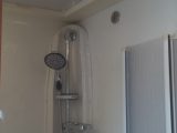 The shower is opposite the toilet/vanity unit and features a handy retractable clothes line