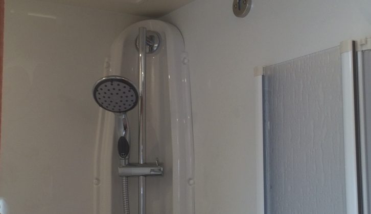 The shower is opposite the toilet/vanity unit and features a handy retractable clothes line