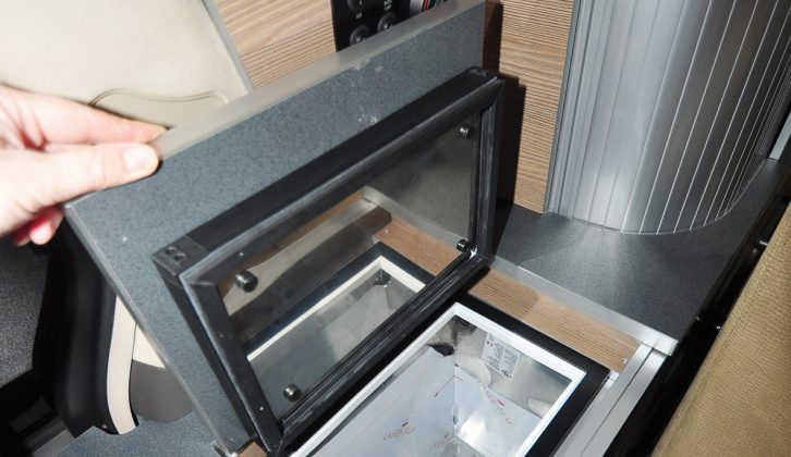 The Wellhouse Alphard is equipped with a top-loading compressor fridge, whose door is fitted right into the extensive worktop – clever!