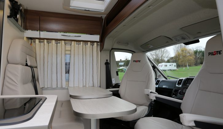 Four can be accommodated at mealtimes in the half-dinette lounge that's kept bright by the rooflight – the smart curtains are fitted as standard