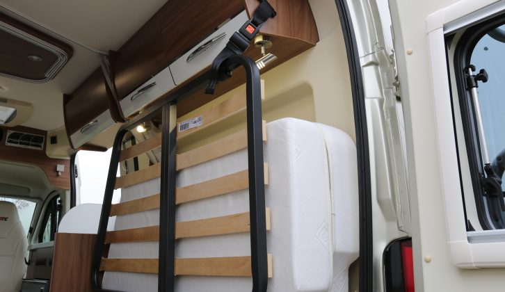 The slatted bed base and mattress are held securely out the way – read more in the Pilote Foxy Van V540G review