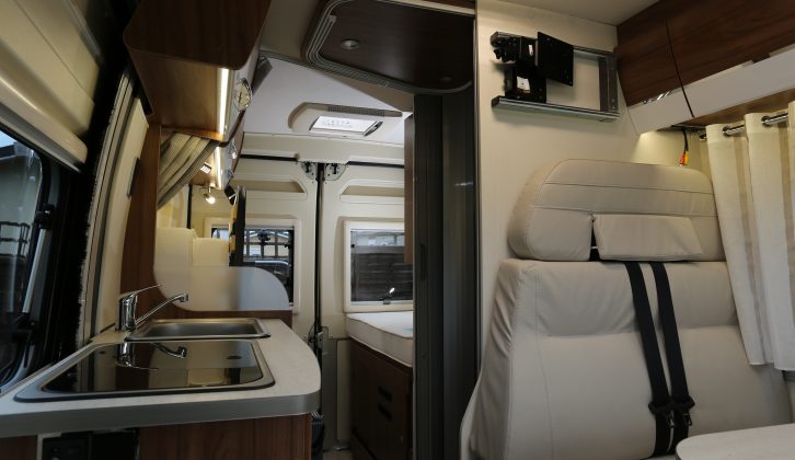 There are two belted travel seats in the half-dinette lounge – the dinette table can be dropped to form the base of an optional third berth
