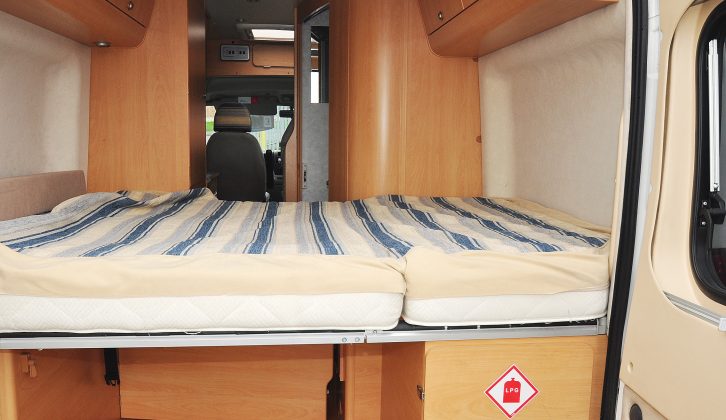 The amazing transverse double bed at the back of the Adria Twin has proper mattresses and there's still room for plenty of luggage