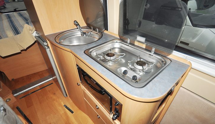 Adria makes the most of the Twin's kitchen space, with a proper three-way fridge, grill, two-ring hob and separate sink