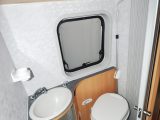 Unlike most campers, the Adria Twin has a washroom with a sink, toilet, shower and window behind a space-saving tambour door