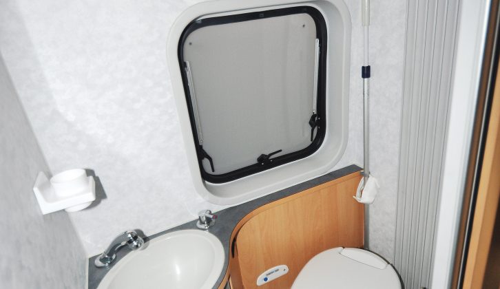 Unlike most campers, the Adria Twin has a washroom with a sink, toilet, shower and window behind a space-saving tambour door