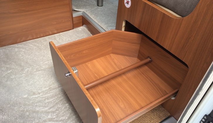 This drawer under the half-dinette sofa is a dedicated shoe store