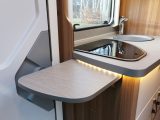 Worktop space is boosted by this extension flap, the sink infill and cooker lid