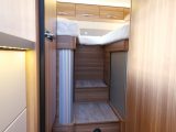 There are two steps up to the twin single beds at the rear, and space-saving tambour doors on the wardrobes