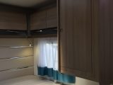 Floating wardrobes hang over the foot of the fixed beds in the Chausson 637