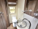 The end washroom has a window and cupboard above the electric-flush swivel toilet – read more in the Practical Motorhome Auto-Sleeper Corinium FB review