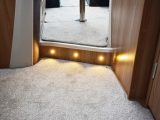 Low-level lighting between living areas is but a small part of the varied options for night-time illumination throughout this Swift motorhome