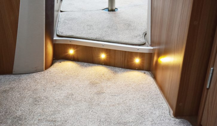 Low-level lighting between living areas is but a small part of the varied options for night-time illumination throughout this Swift motorhome