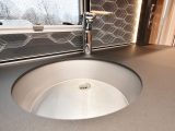 The stainless-steel sink comes with a clip-on drainer, to maximise work surface when it’s needed, and the splashback lights up