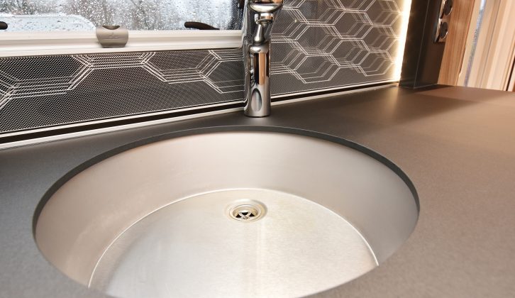 The stainless-steel sink comes with a clip-on drainer, to maximise work surface when it’s needed, and the splashback lights up