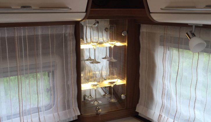 An attractively-lit glasses cabinet in each corner, plus ambient lighting, helps give an upmarket feel