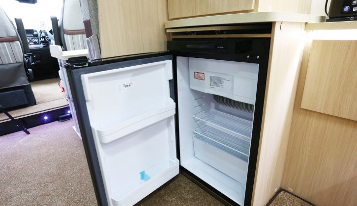 The dual-fuel fridge has a separate freezer compartment and is logically positioned at the end of the kitchen